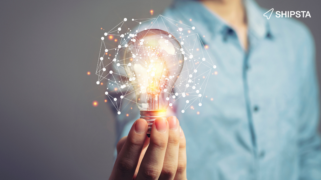 Man holding a lightbulb with freight lanes around it.